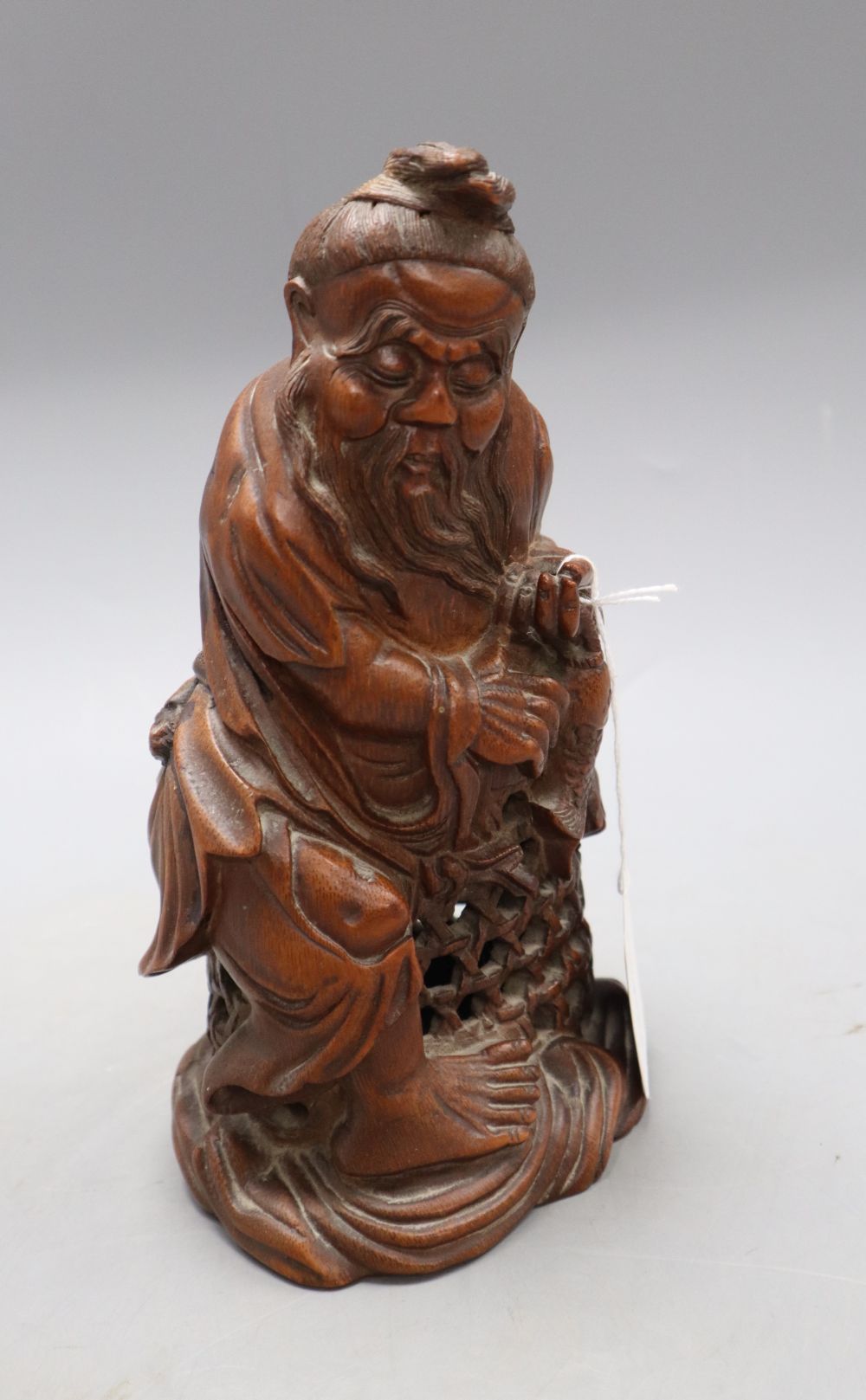 A Chinese bamboo figure of a fisherman, late 19th/early 20th century, H. 23.5cm